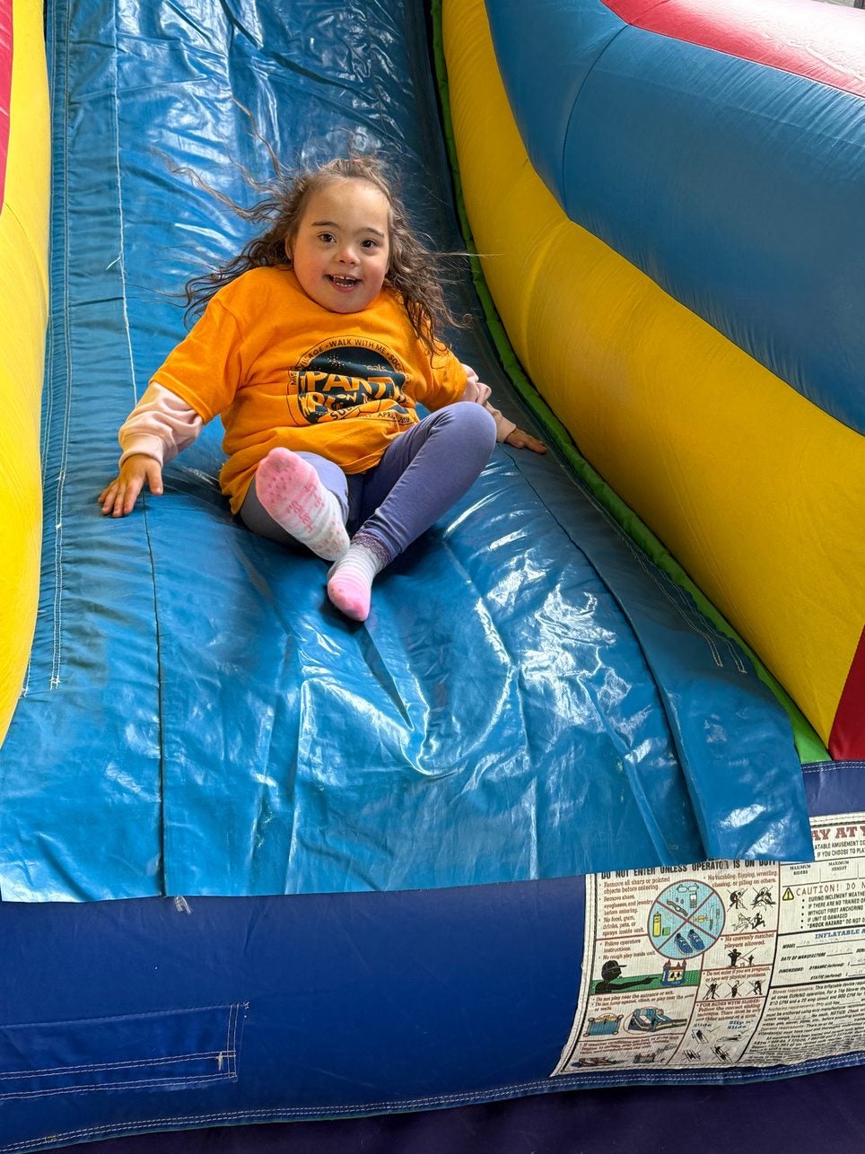 Gabriella on an inflatable slide.